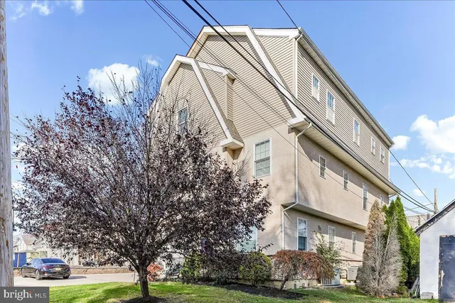 a view of a building with a yard