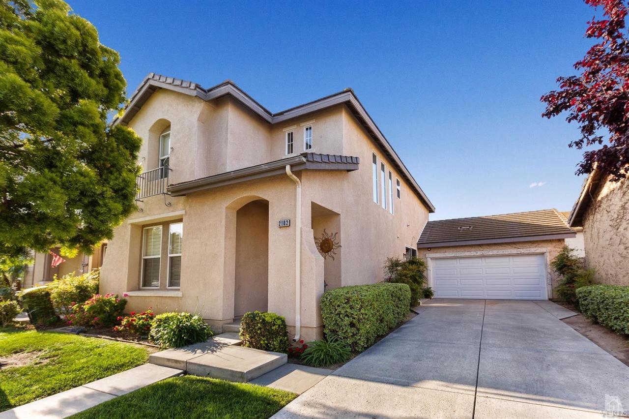 2102 Ribera Drive Oxnard, CA 93030 - Photo 1 of 18 a view of a house with yard and plants