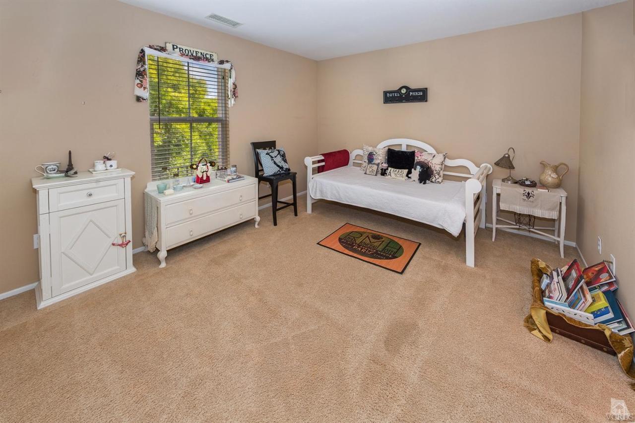 2102 Ribera Drive Oxnard, CA 93030 - Photo 12 of 18 a bedroom with furniture and a window