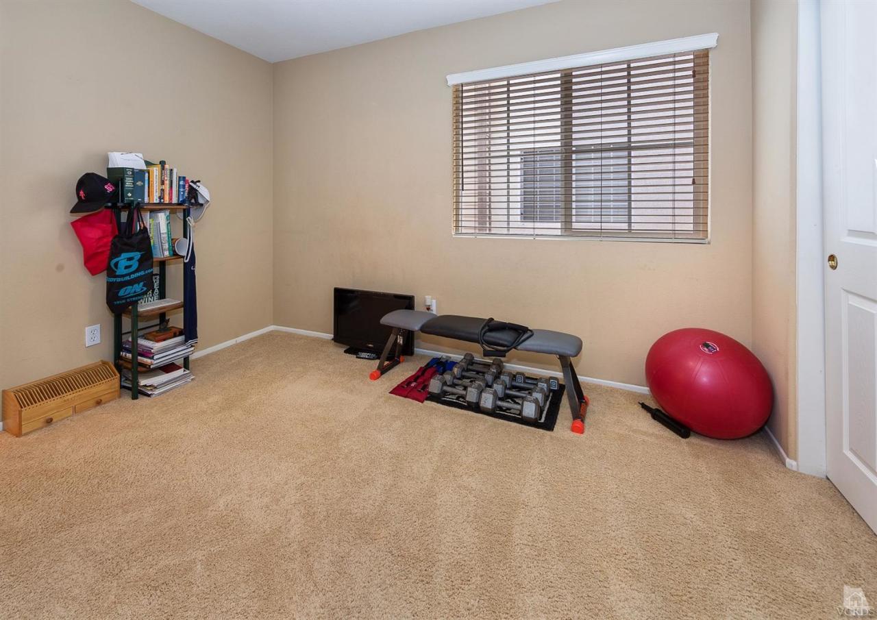 2102 Ribera Drive Oxnard, CA 93030 - Photo 13 of 18 a room with furniture and gym equipment