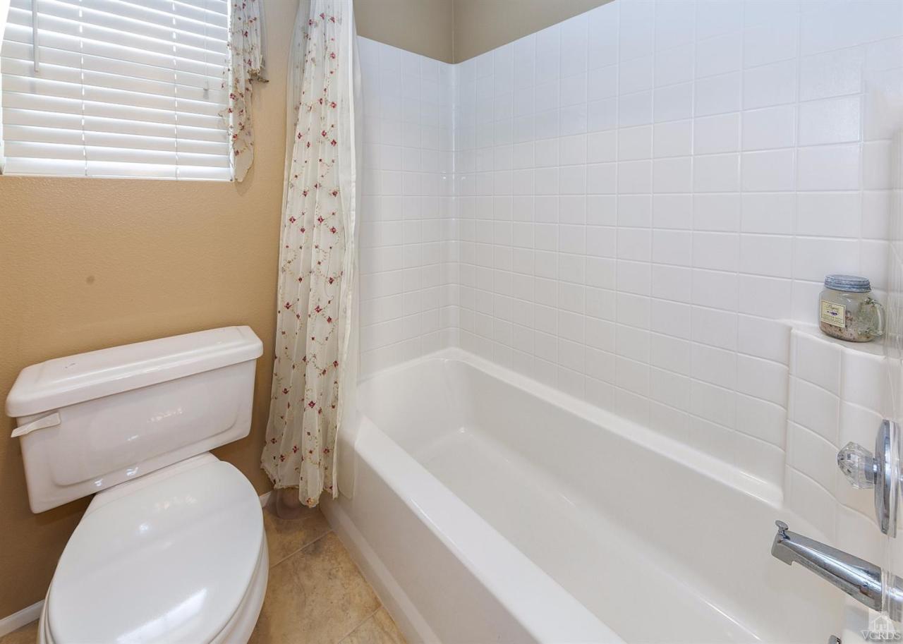 2102 Ribera Drive Oxnard, CA 93030 - Photo 14 of 18 a bathroom with a toilet and a bathtub