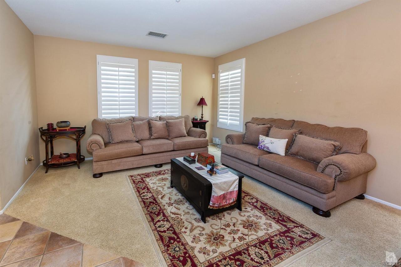 2102 Ribera Drive Oxnard, CA 93030 - Photo 2 of 18 a living room with furniture a rug and a window