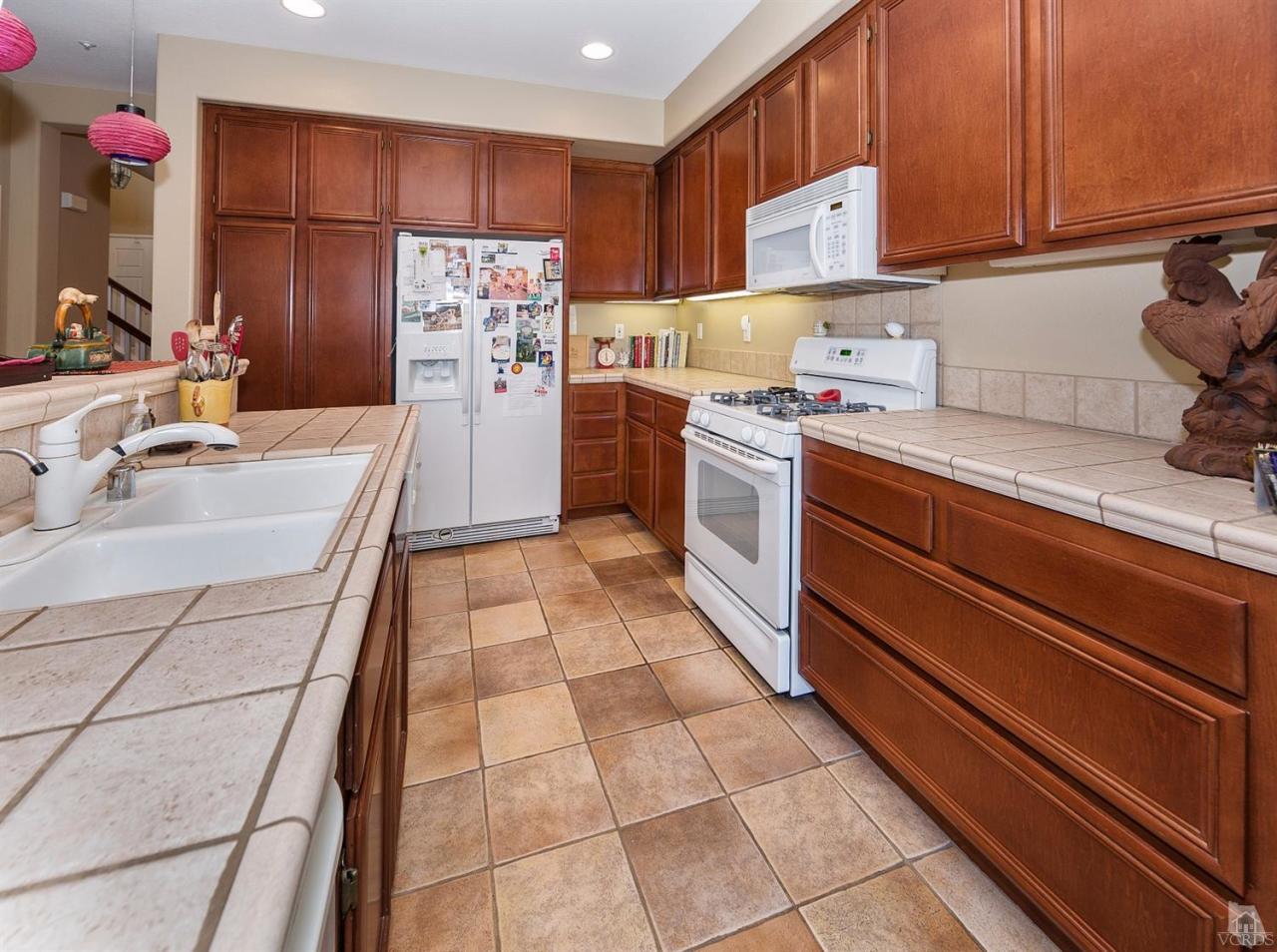 2102 Ribera Drive Oxnard, CA 93030 - Photo 6 of 18 a kitchen with stainless steel appliances granite countertop a sink and cabinets