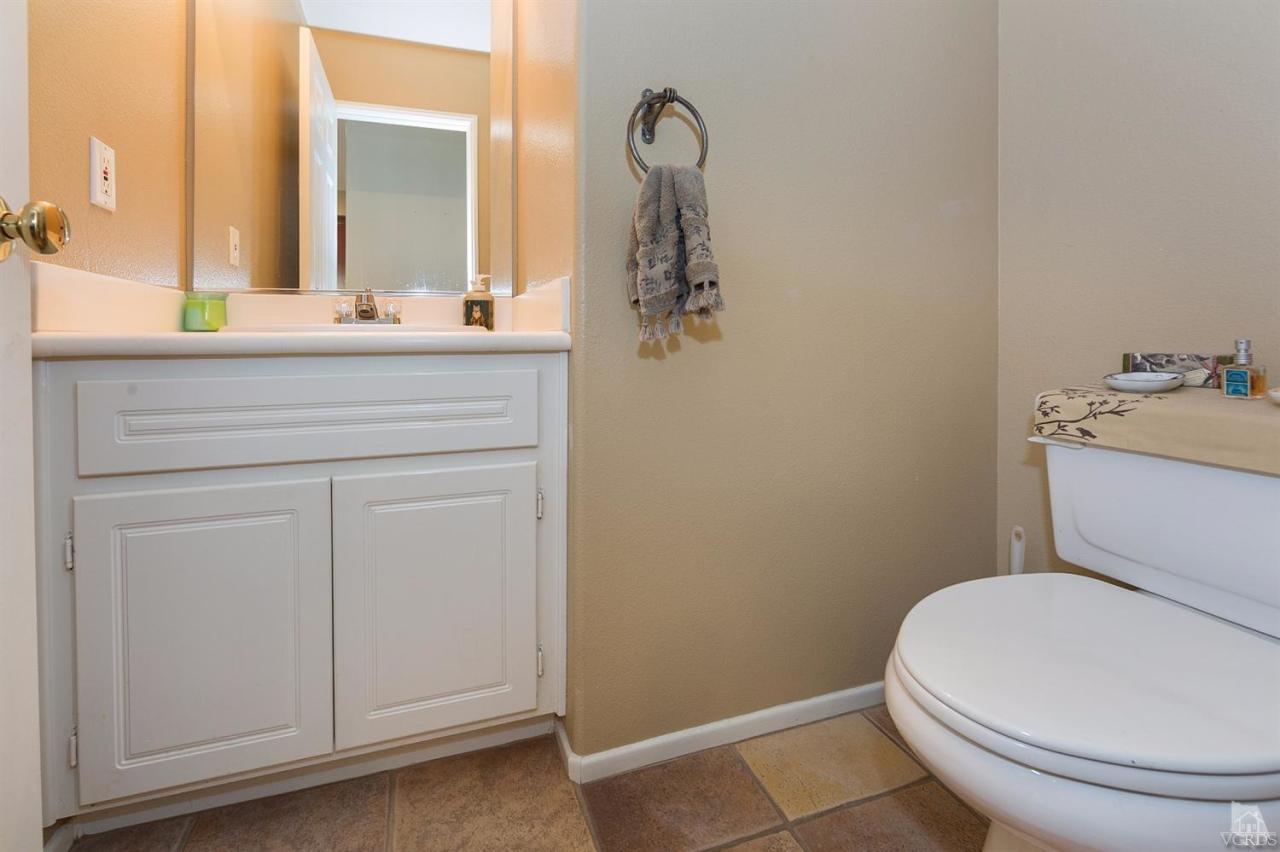 2102 Ribera Drive Oxnard, CA 93030 - Photo 9 of 18 a bathroom with a sink a toilet and mirror