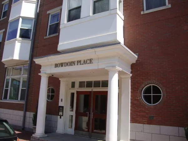 a view of a brick building with a door