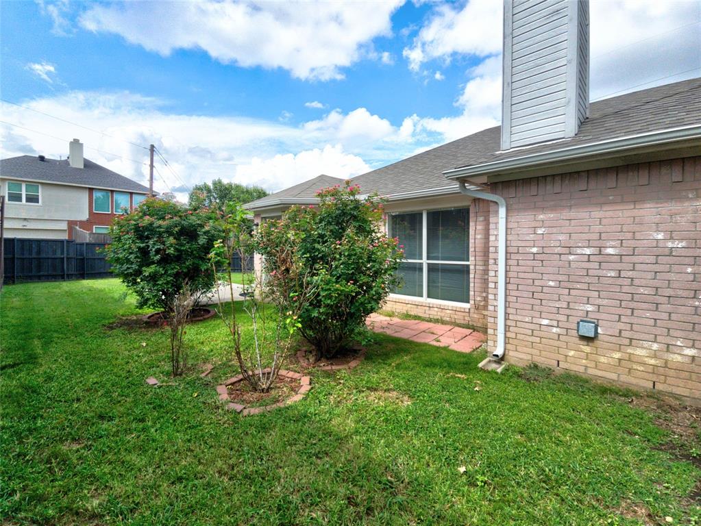 12000 Port Road Frisco, TX 75035 - Photo 39 of 40 Expansive lawn area featuring established shrubs and brick paver patio
