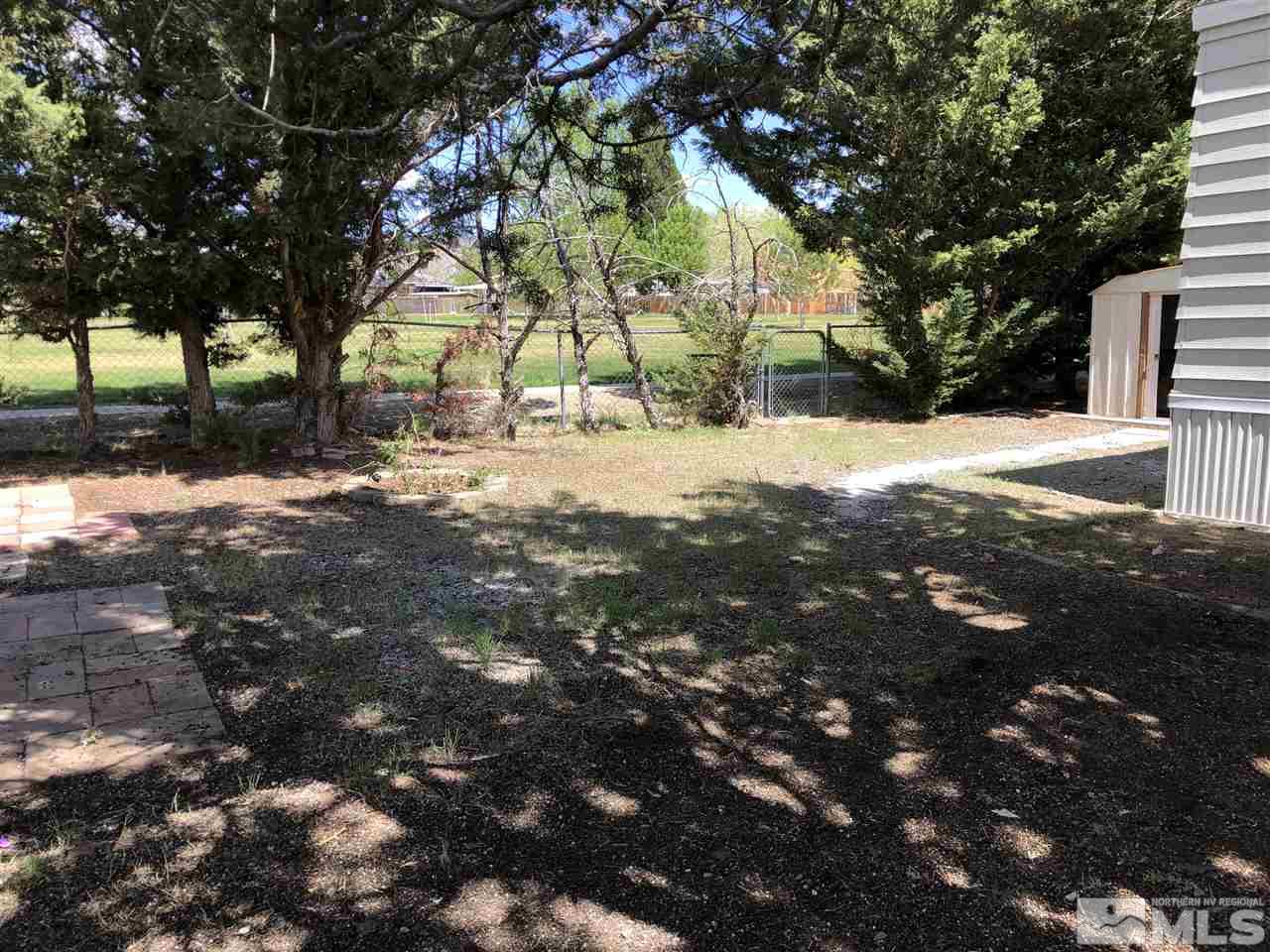 14060 Rhyolite Circle, Unit 89521 Reno, NV 89521 - Photo 18 of 18 a view of yard with tree