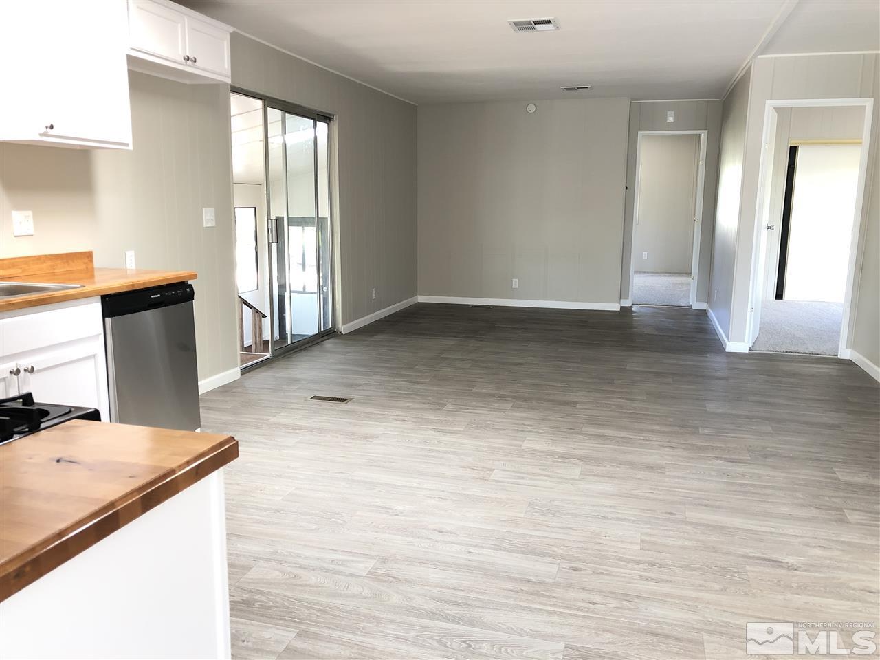 14060 Rhyolite Circle, Unit 89521 Reno, NV 89521 - Photo 5 of 18 a view of a kitchen cabinets and wooden floor