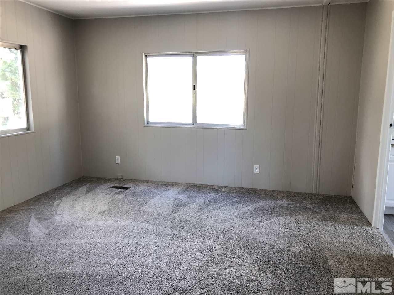 14060 Rhyolite Circle, Unit 89521 Reno, NV 89521 - Photo 8 of 18 an empty room with a window