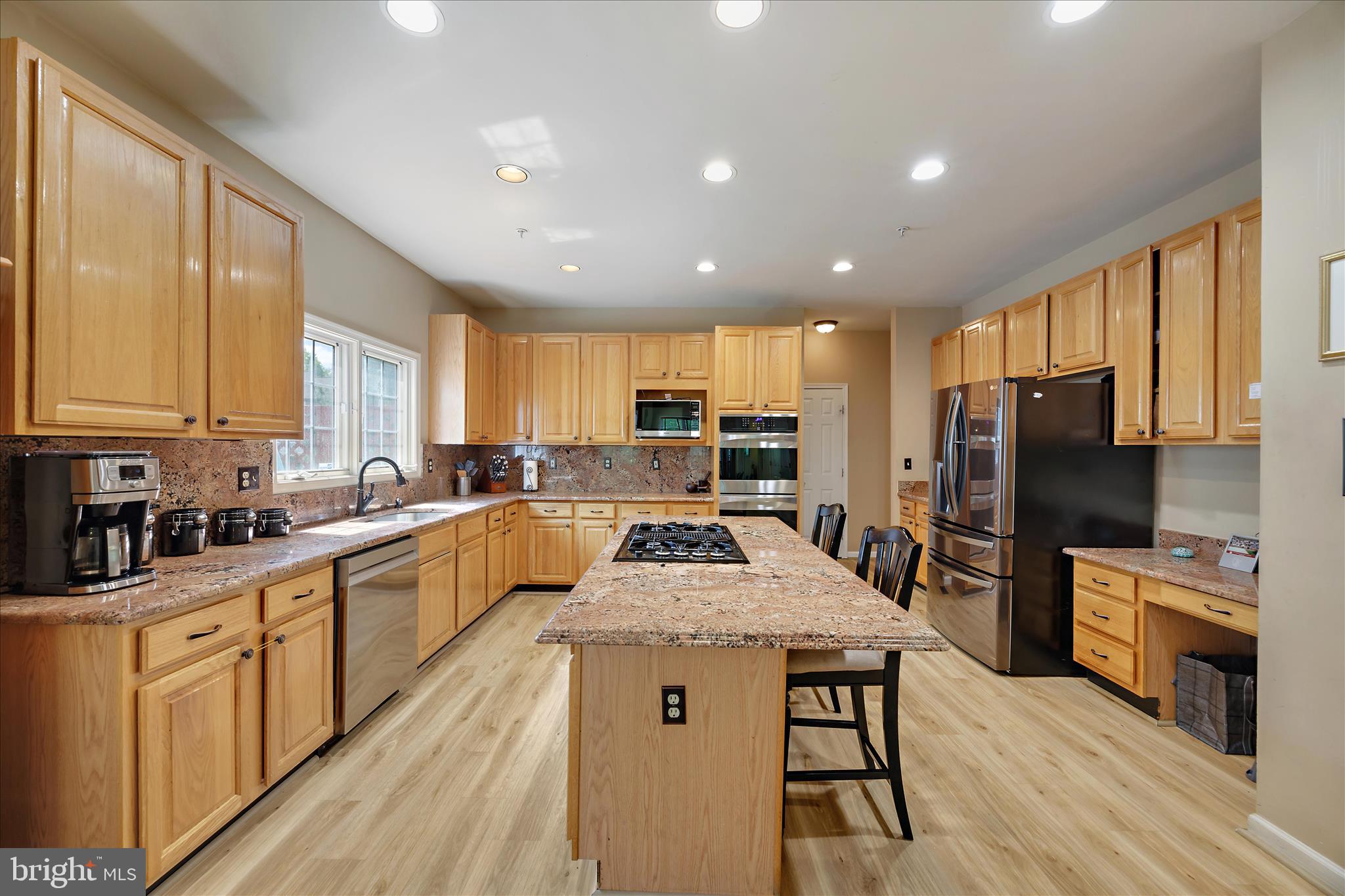 3303 Dunwood Ridge Terrace Bowie, MD 20721 - Photo 18 of 76 Large cooking and seating island, wood floors