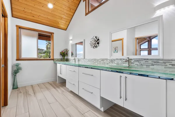 a bathroom with a sink and mirror