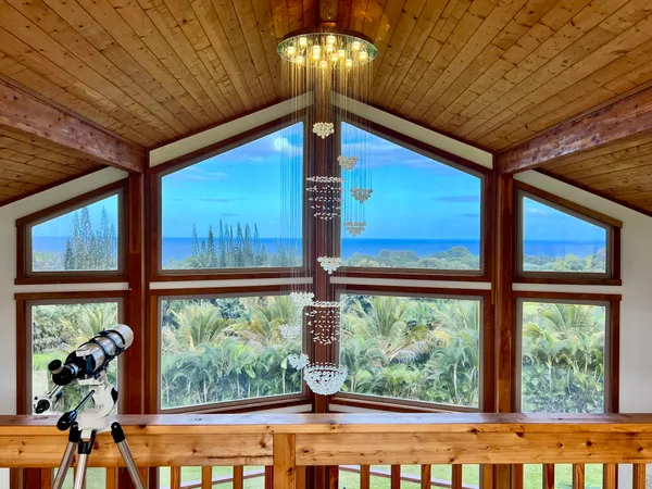 a view of a balcony with furniture