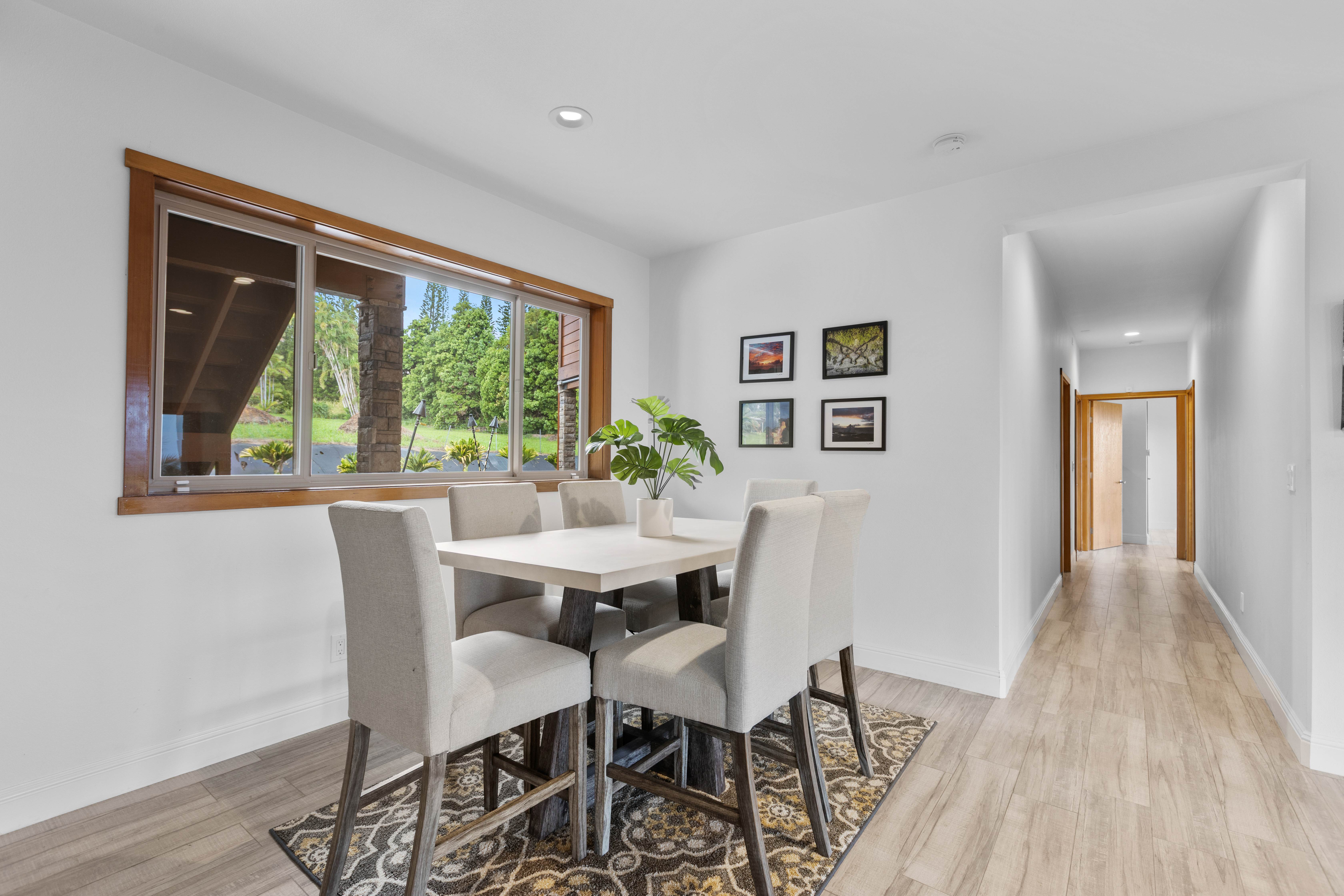 28-425 Overpass Road Pepeekeo, HI 96783 - Photo 20 of 30 a view of a dining room with furniture window and wooden floor