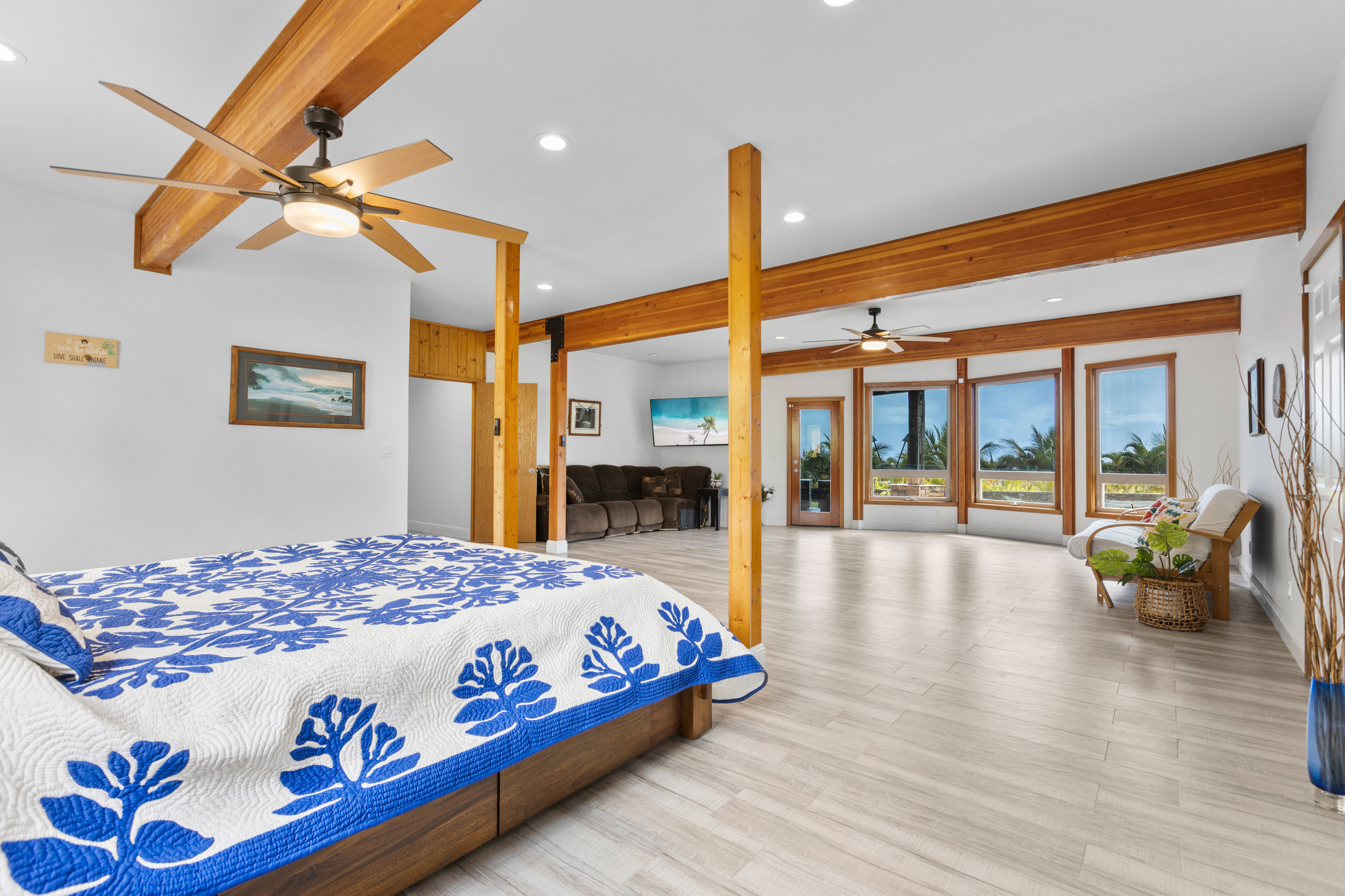 28-425 Overpass Road Pepeekeo, HI 96783 - Photo 21 of 30 a bedroom with a bed and glass walk in closet