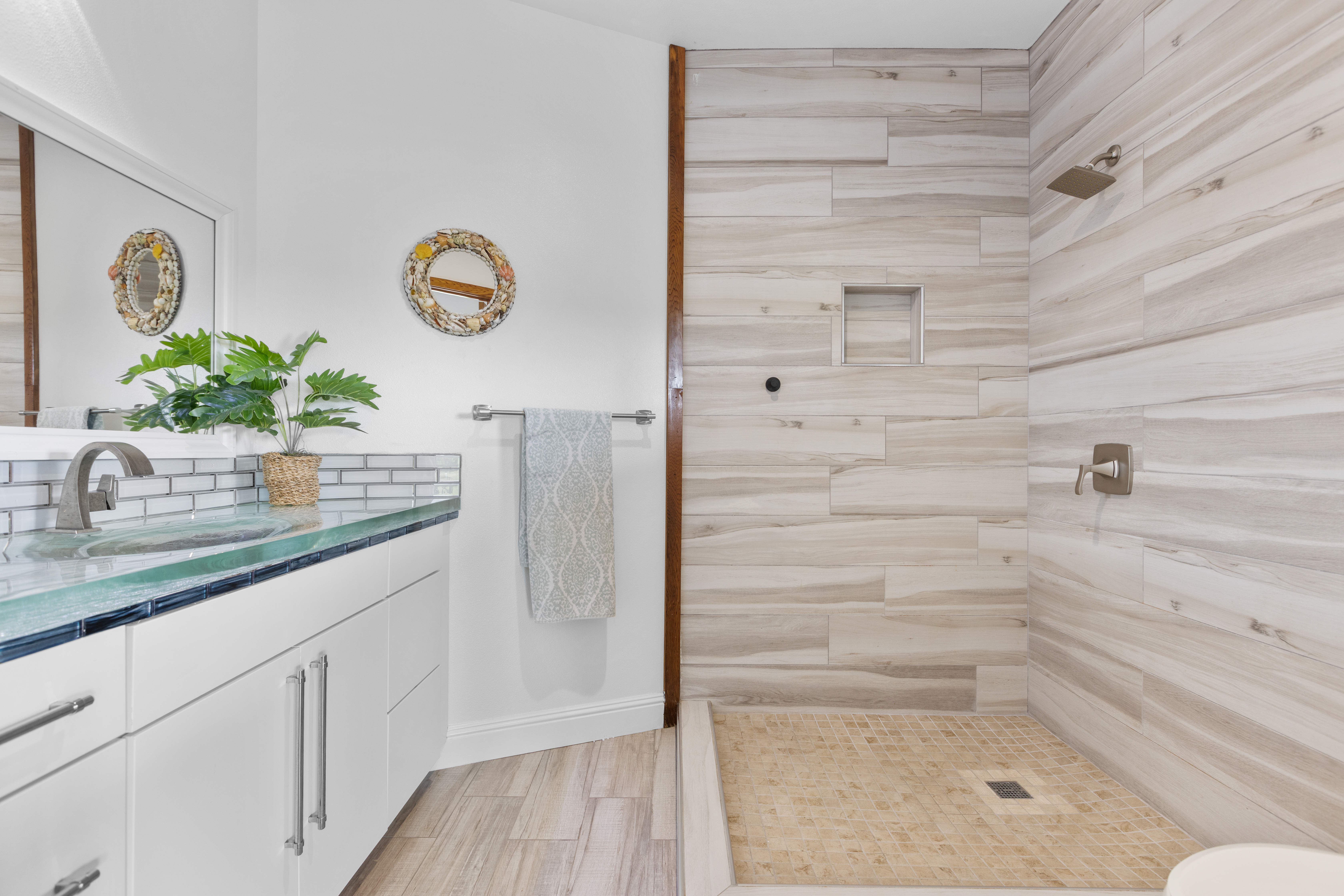 28-425 Overpass Road Pepeekeo, HI 96783 - Photo 22 of 30 a bathroom with a granite countertop sink and a mirror