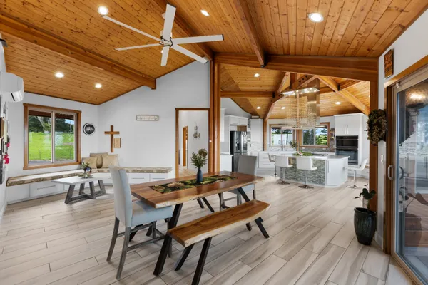 a building outdoor space with patio furniture and wooden floor