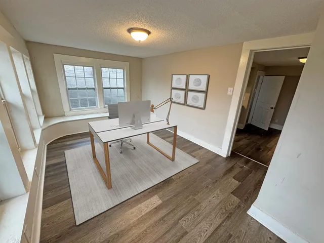 a bed room with a bed and a window