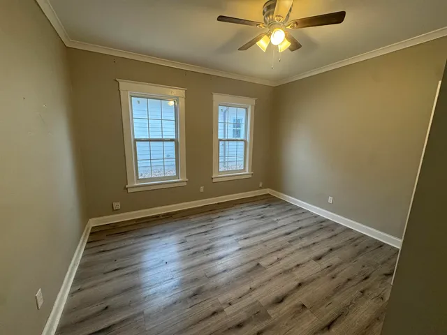 a kitchen with a stove a sink and a refrigerator