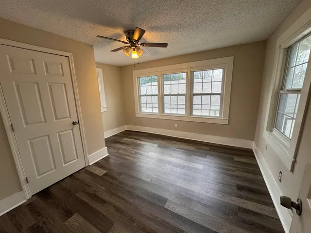 a kitchen with stainless steel appliances granite countertop a refrigerator and a stove