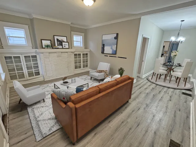 a kitchen with wooden floors and cabinets