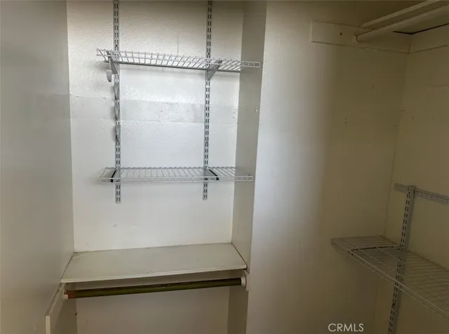 a white toilet sitting next to a tub