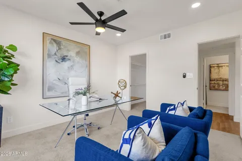a view of a livingroom with furniture and wooden floor