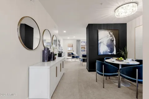 a view of a livingroom with furniture and a mirror