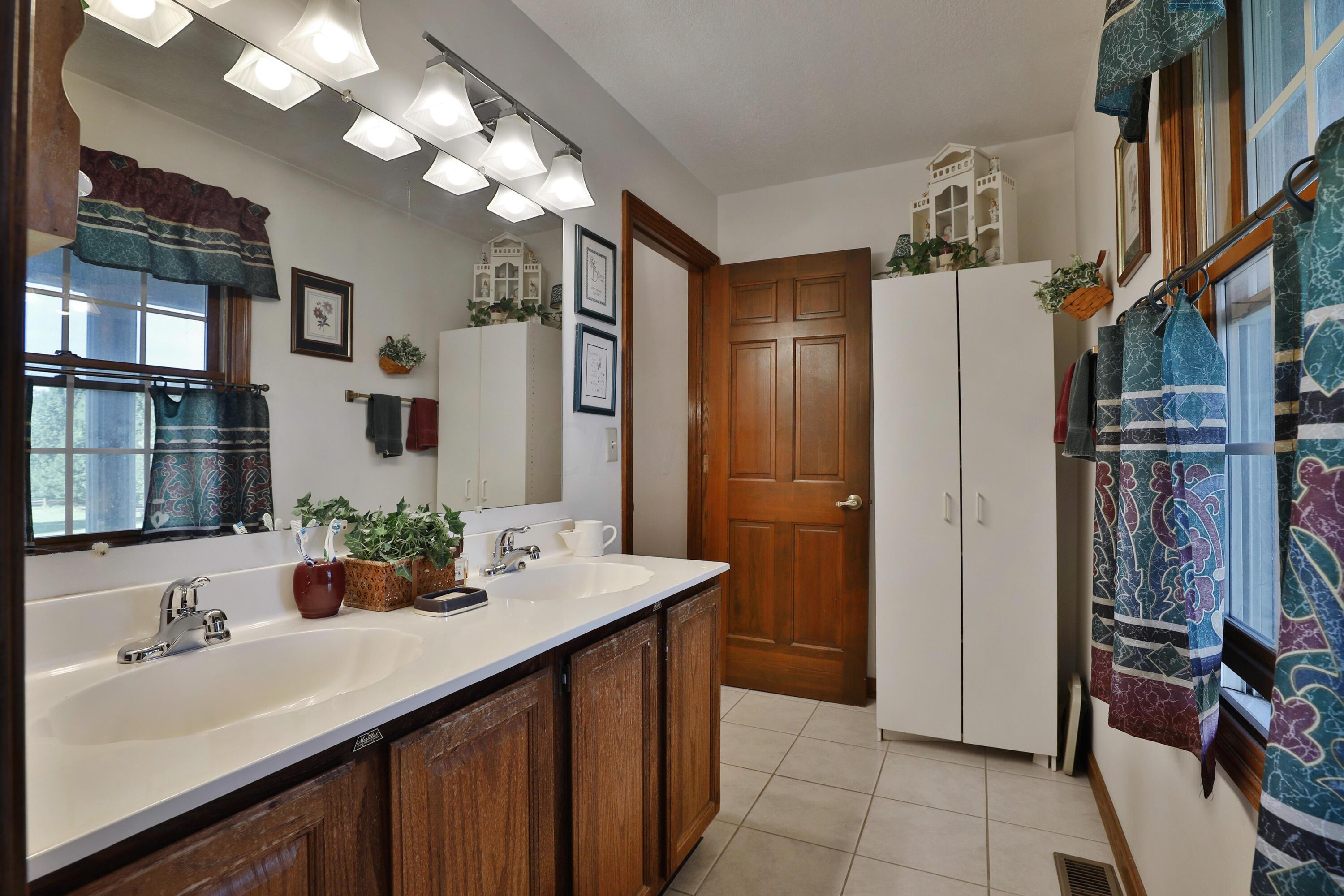 7162 Davis Road Hilliard, OH 43026 - Photo 23 of 42 Hall bath vanity separate from tub/toilet and shower area.