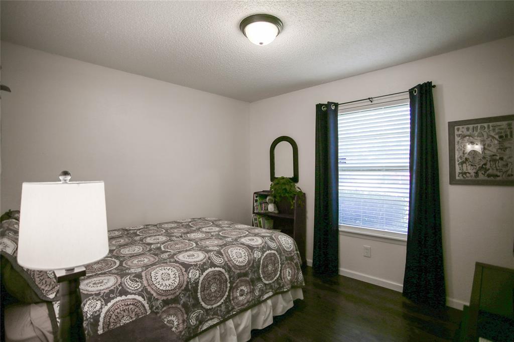 1720 Crystal Way Plano, TX 75074 - Photo 19 of 32 a bedroom with a bed and a window