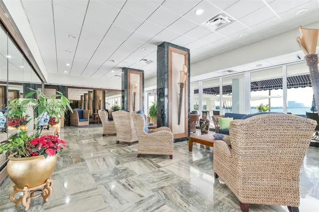 a living room with furniture and flowers