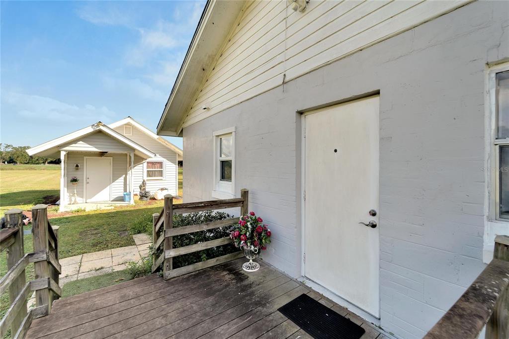 5030 Sydney Road Plant City, FL 33566 - Photo 14 of 23 a view of a room with wooden floor and white walls