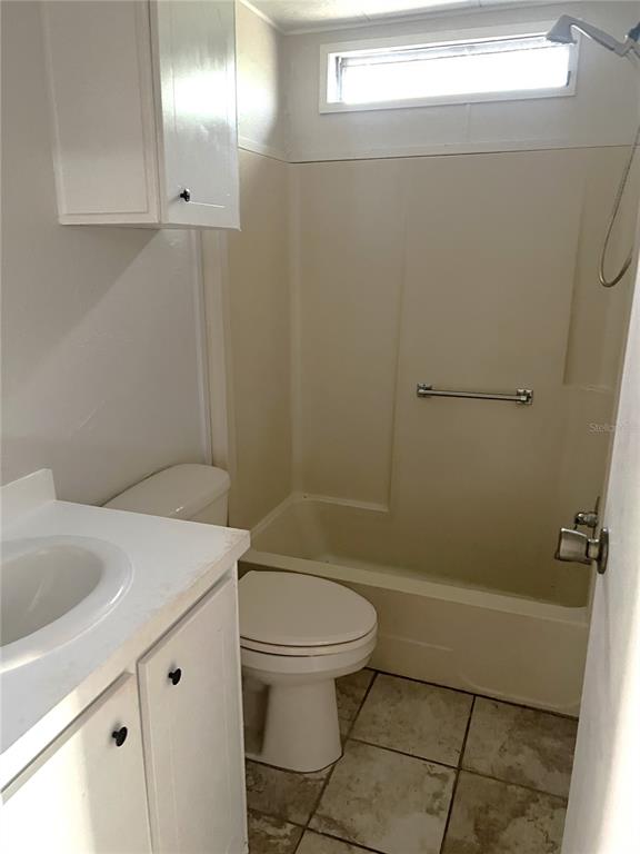 5030 Sydney Road Plant City, FL 33566 - Photo 22 of 23 a bathroom with a sink a toilet and shower