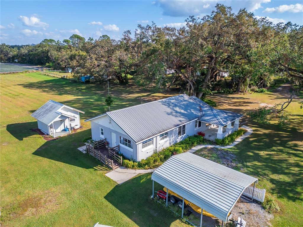 5030 Sydney Road Plant City, FL 33566 - Photo 5 of 23 a view of a house with pool and a yard