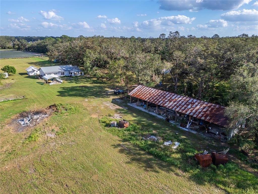 5030 Sydney Road Plant City, FL 33566 - Photo 6 of 23 a view of a lake with a yard