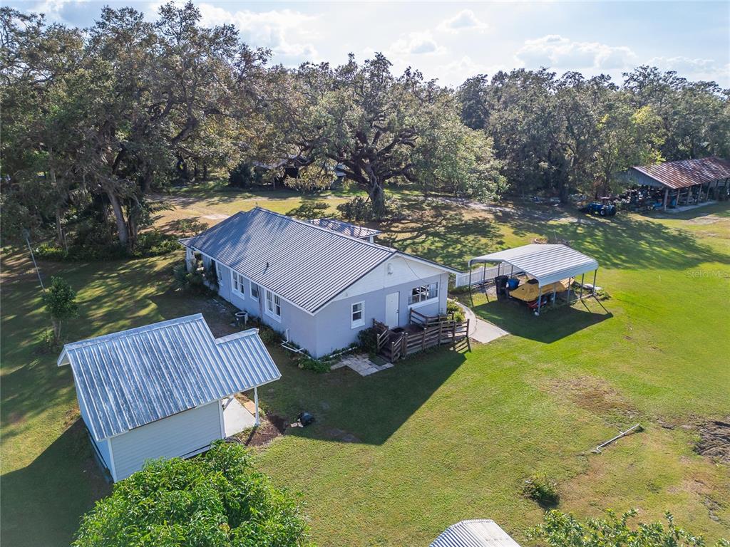5030 Sydney Road Plant City, FL 33566 - Photo 7 of 23 an aerial view of houses with yard
