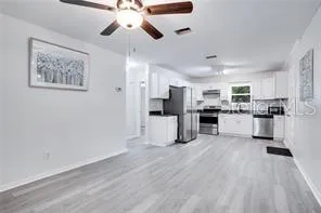 a view of an empty room with a fan