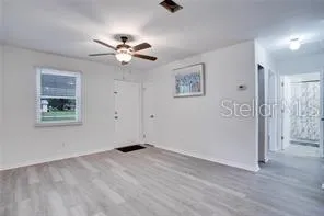 a view of an empty room with a window