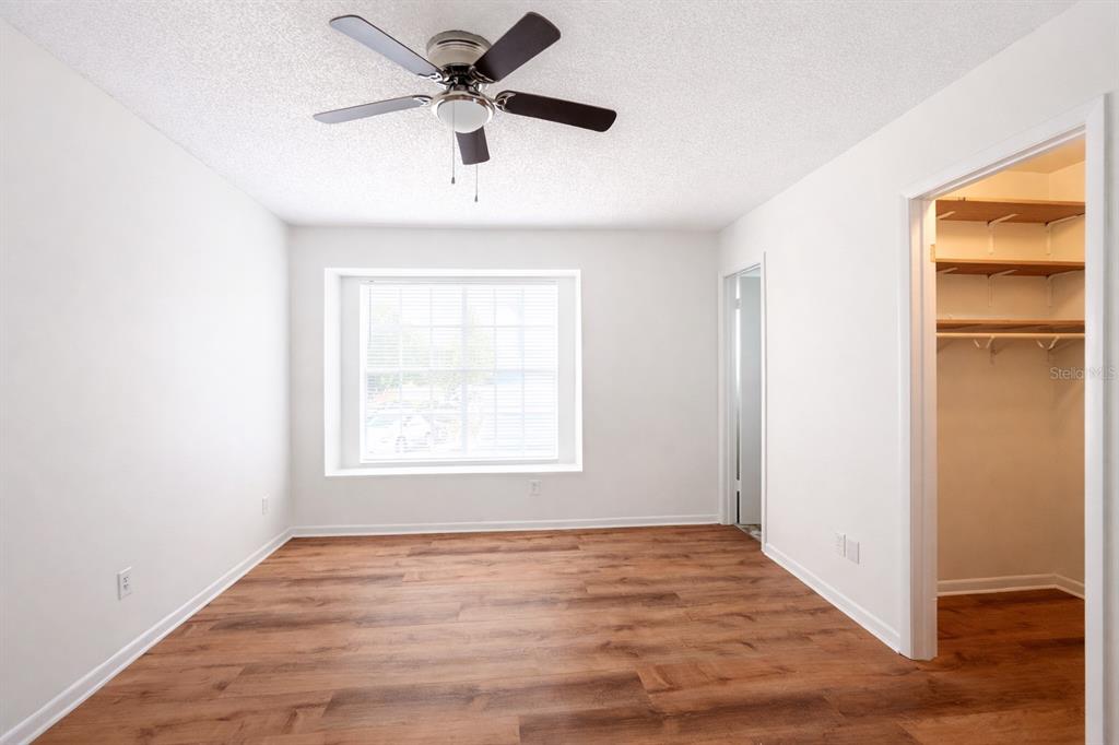 11008 Yorkshire Ridge Court Orlando, FL 32837 - Photo 17 of 24 an empty room with a window and a ceiling fan