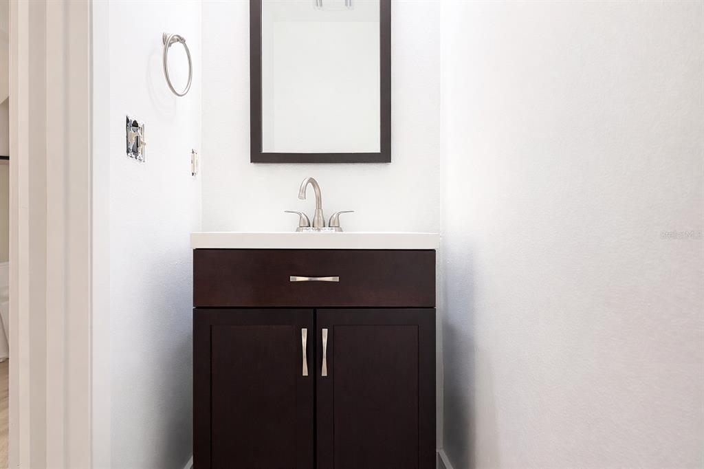 11008 Yorkshire Ridge Court Orlando, FL 32837 - Photo 21 of 24 a bathroom with a sink and mirror