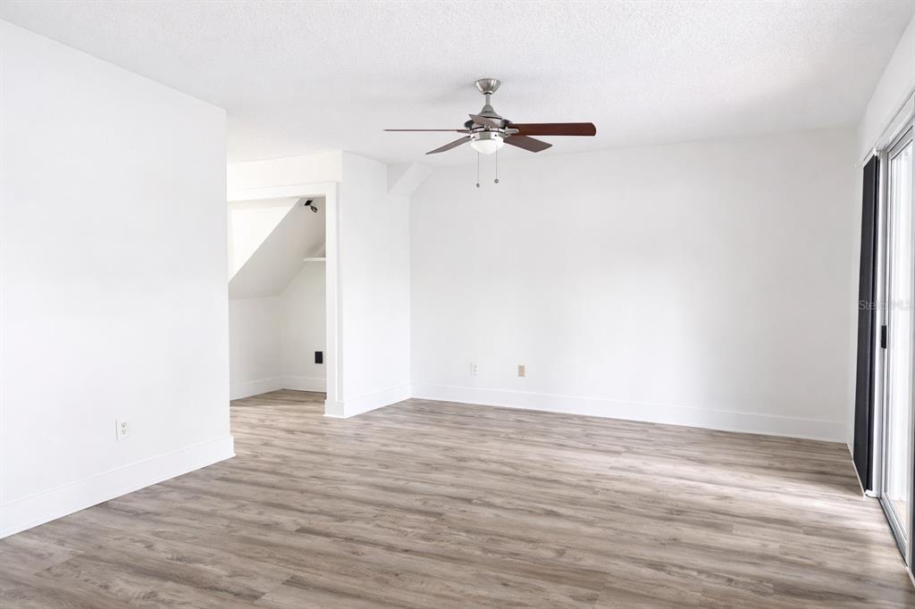 11008 Yorkshire Ridge Court Orlando, FL 32837 - Photo 5 of 24 a view of a room with wooden floor