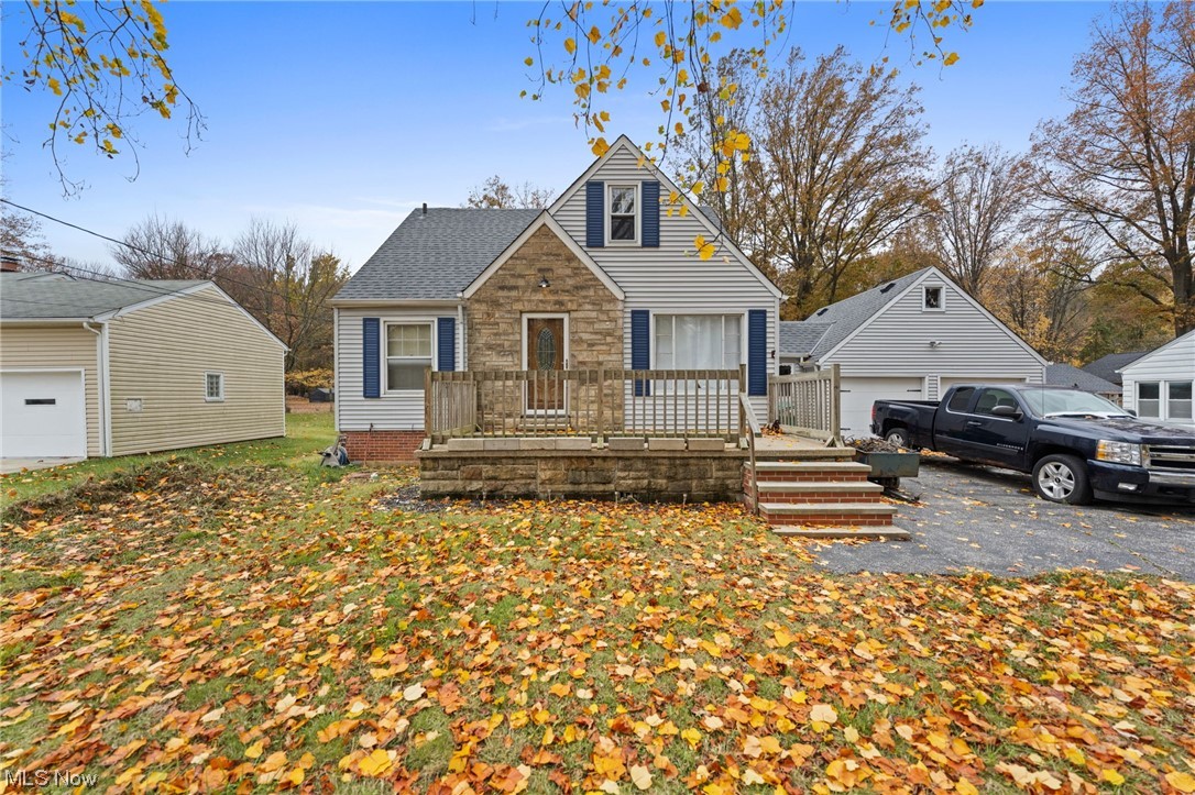 6454 Crossview Road Independence, OH 44131 - Photo 2 of 27 View of front of property with a garage and covered porch