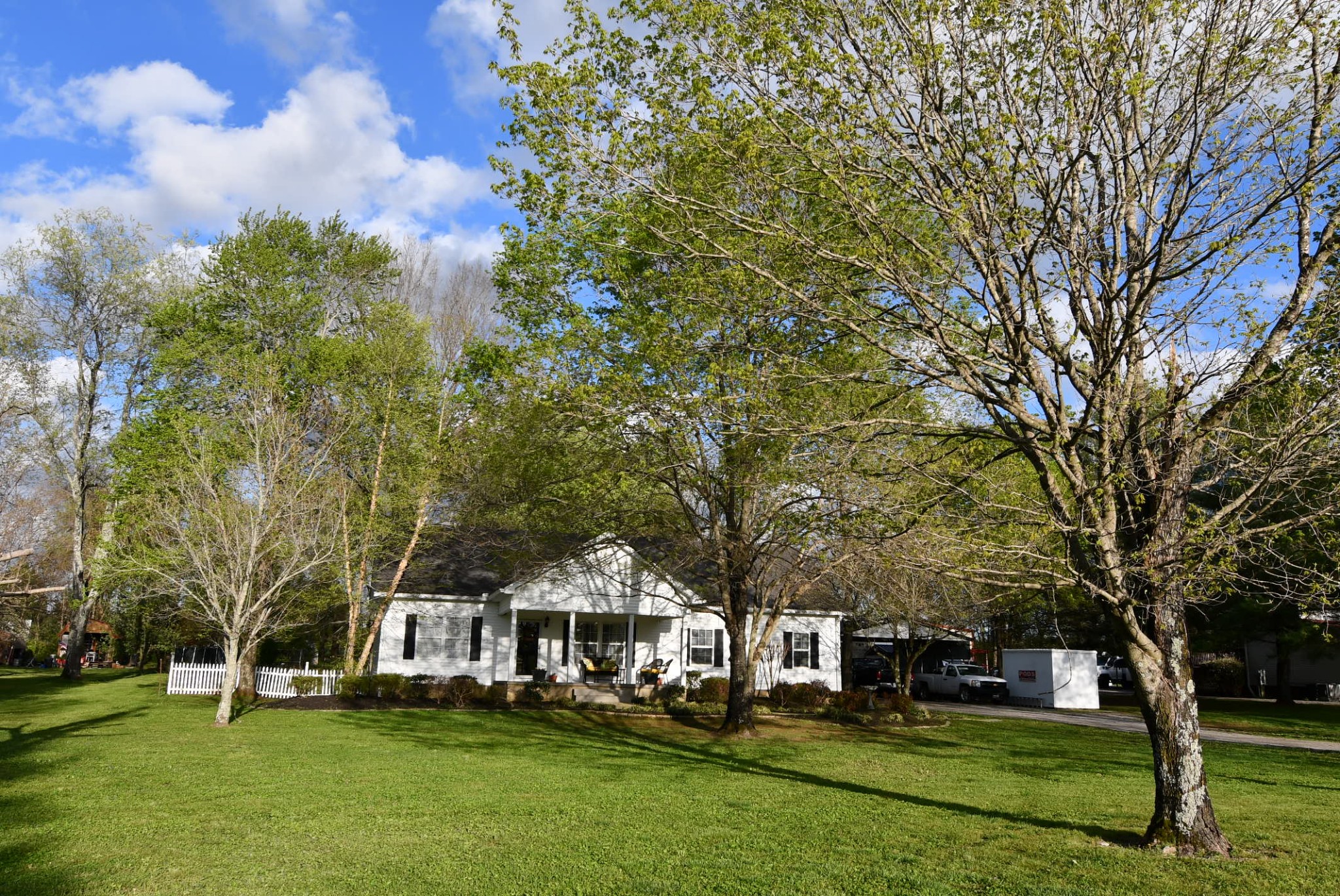 641 McCrary Road Lebanon, TN 37090 - Photo 1 of 47 a front view of a house with a garden and trees