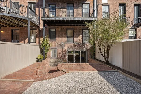 a building with table and chairs in front of it