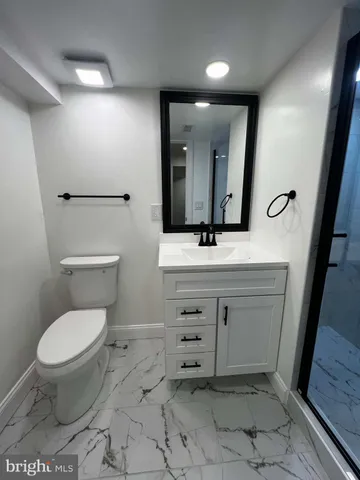 a view of an empty room and fire place