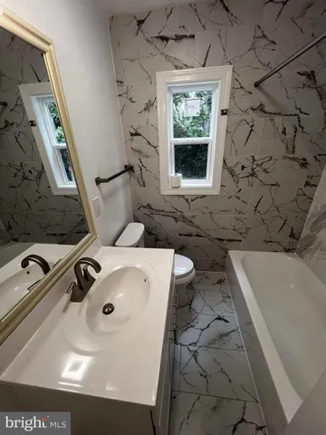 a bathroom with a sink and a bathtub