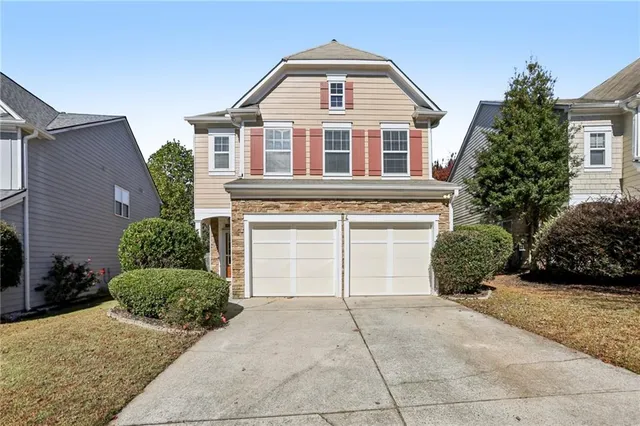 a front view of a house with garden