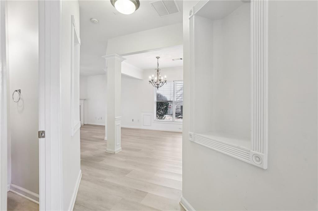 5940 Bentley Way Cumming, GA 30040 - Photo 11 of 39 a bathroom with a bathtub