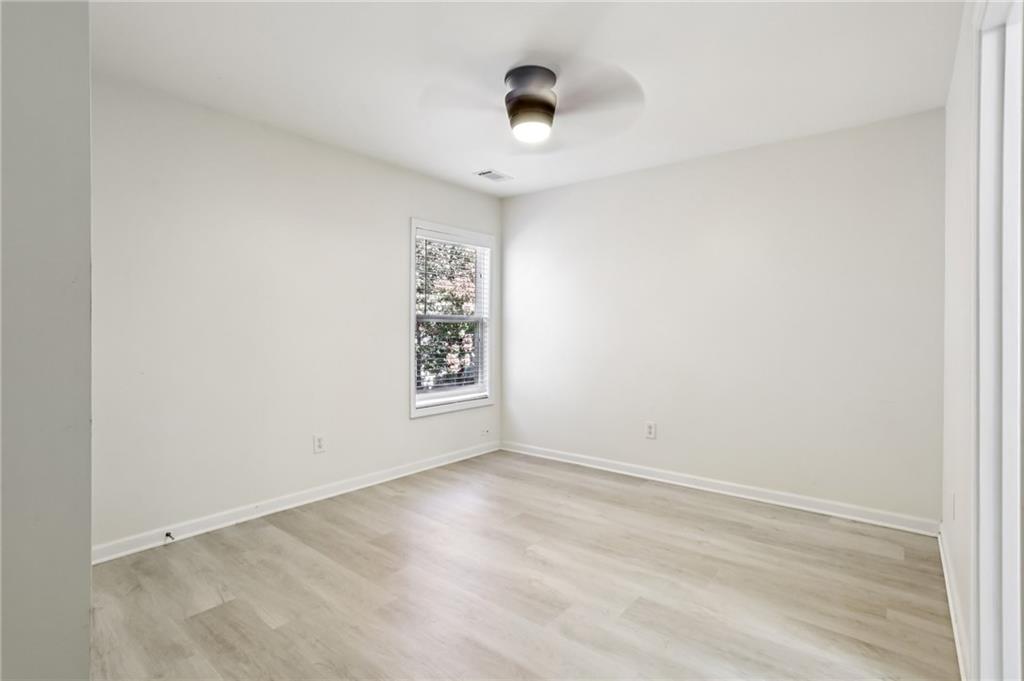 5940 Bentley Way Cumming, GA 30040 - Photo 20 of 39 a view of an empty room with a window