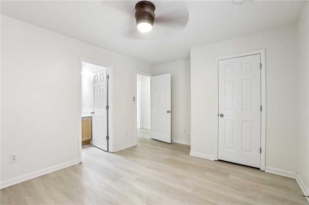 5940 Bentley Way Cumming, GA 30040 - Photo 21 of 39 an empty room with wooden floor and windows