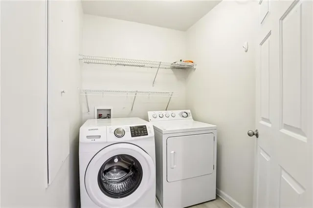 an empty room with window and a ceiling fan